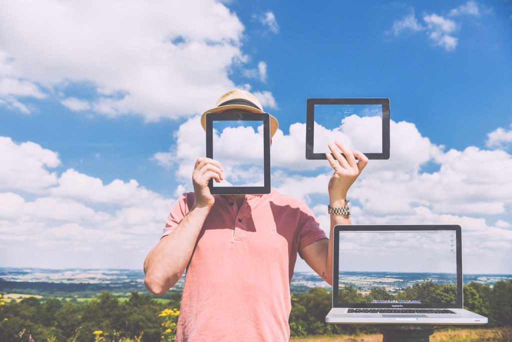 representation of virtual desktops, man holding frames showing clouds